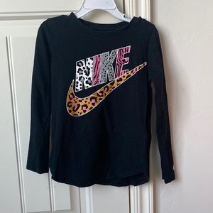 Black Nike long sleeve with animal print logo. Comes in a kids Medium.